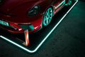 GuardPad bolt in front of a sports car on the illuminated platform